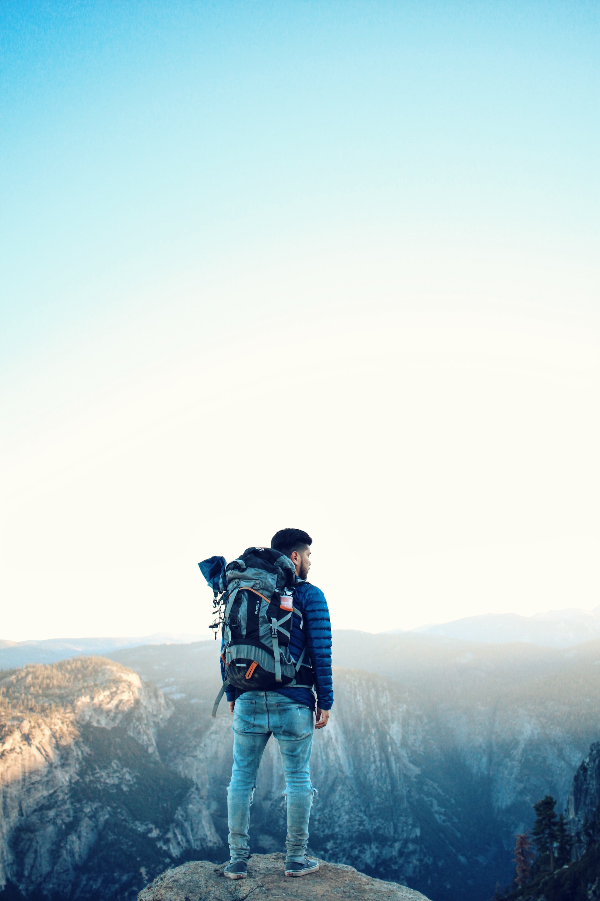 Photograph of a backpacker with in the background mountains